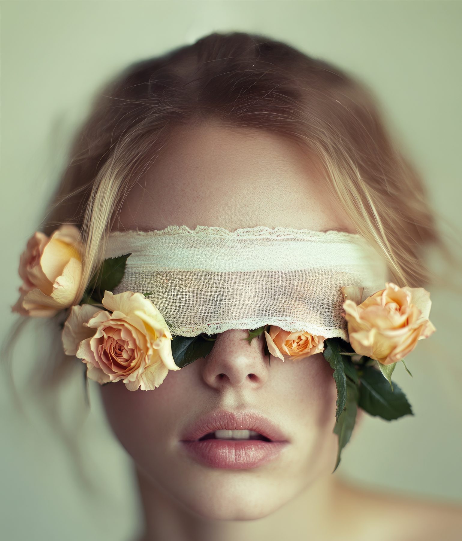 Portrait with white lace blindfold and roses