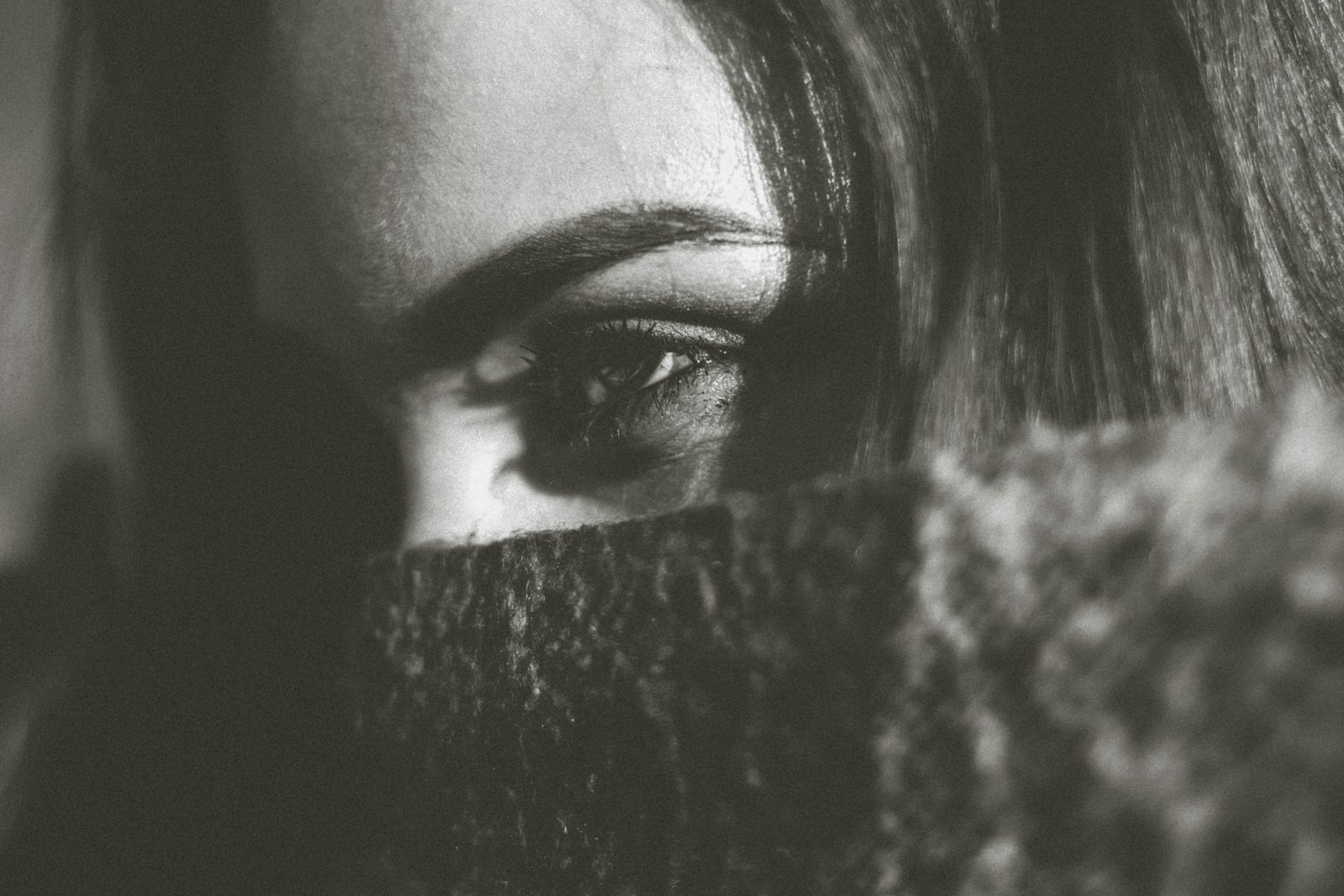 Single eye above dark fabric
